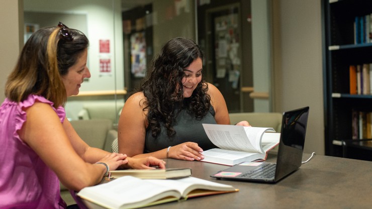 Professor Erika Bagley works with Isabella Caban-Echevarria on psychology research.